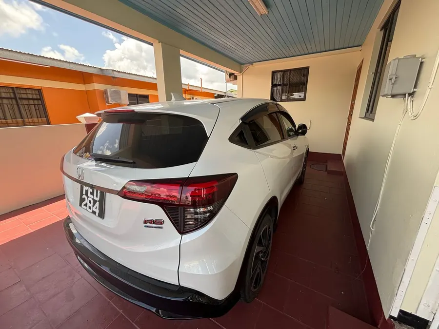 Rear three-quarter view showing Honda Vezel RS Hybrid badging